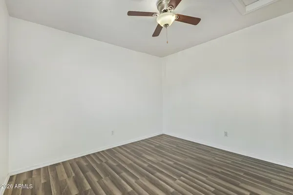 a bathroom with a granite countertop sink a large mirror and a shower