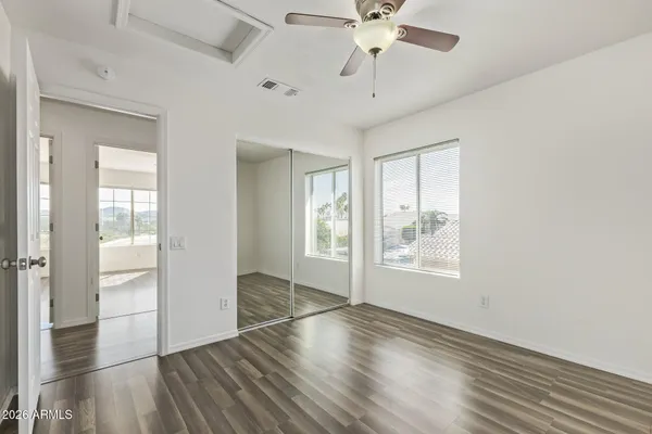 a view of an empty room with a balcony
