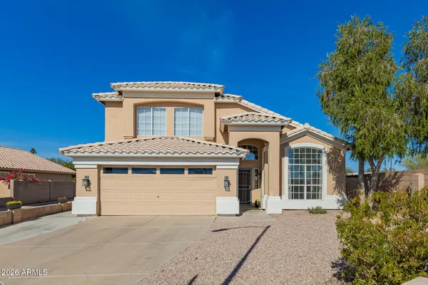 a front view of a house with a garage