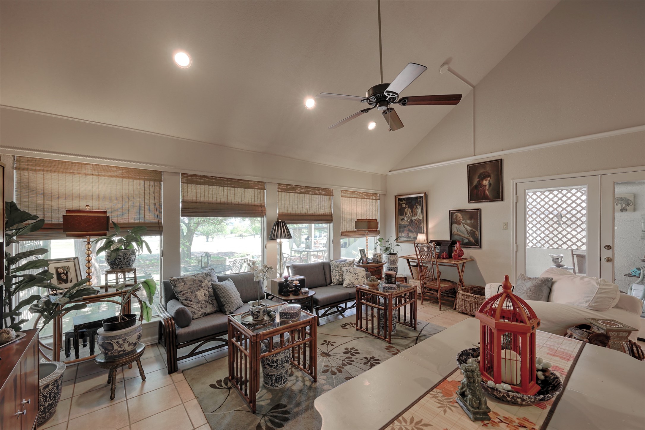 34 April Hill Conroe, TX 77356 - Photo 13 of 33 Large windows with natural window coverings overlook the golf course with views of the lake beyond. The neutral paint color and flooring will coordinate with any decor!