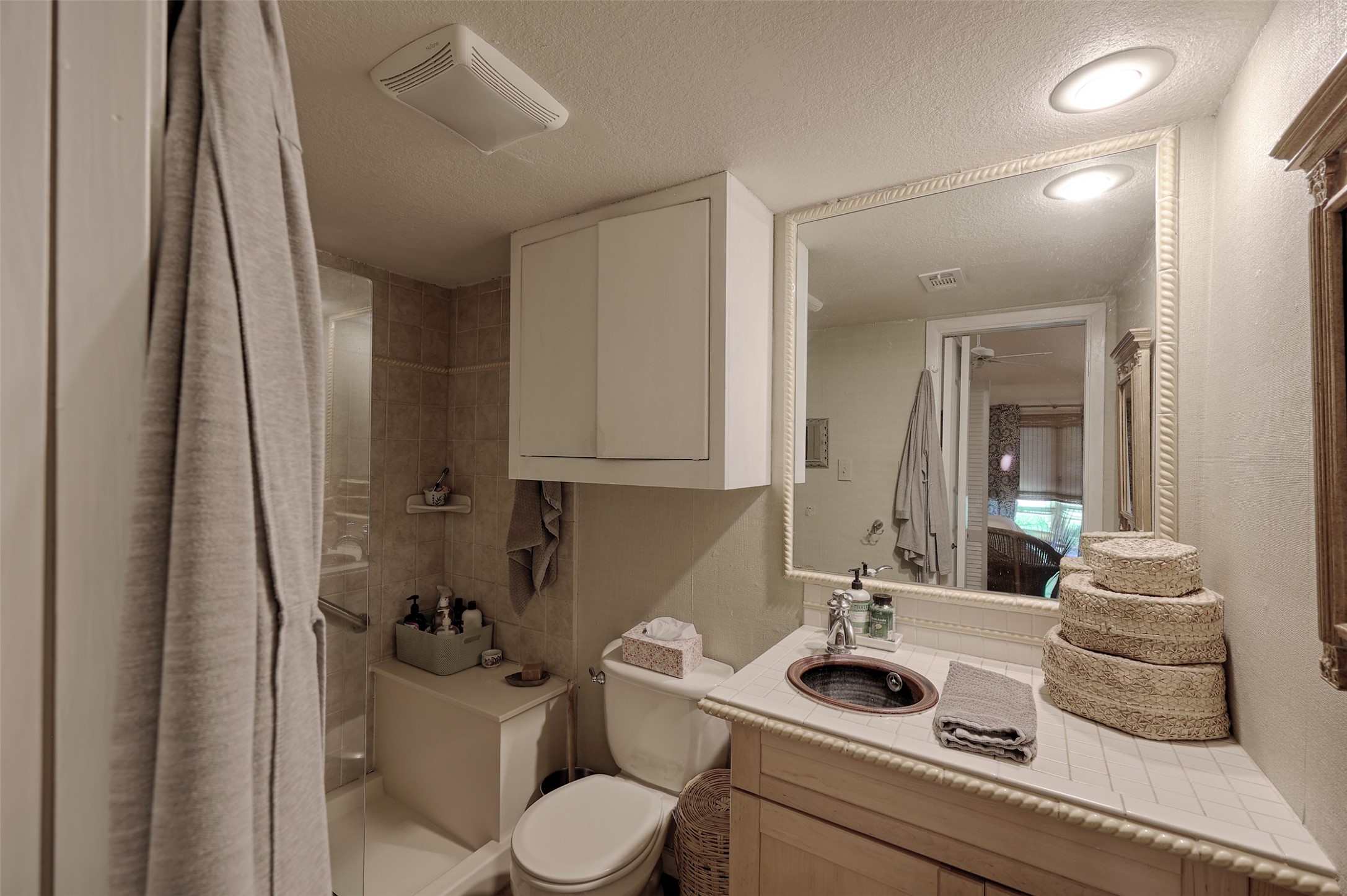 34 April Hill Conroe, TX 77356 - Photo 17 of 33 The primary ensuite bath with shower and vanity with interesting tile detail.