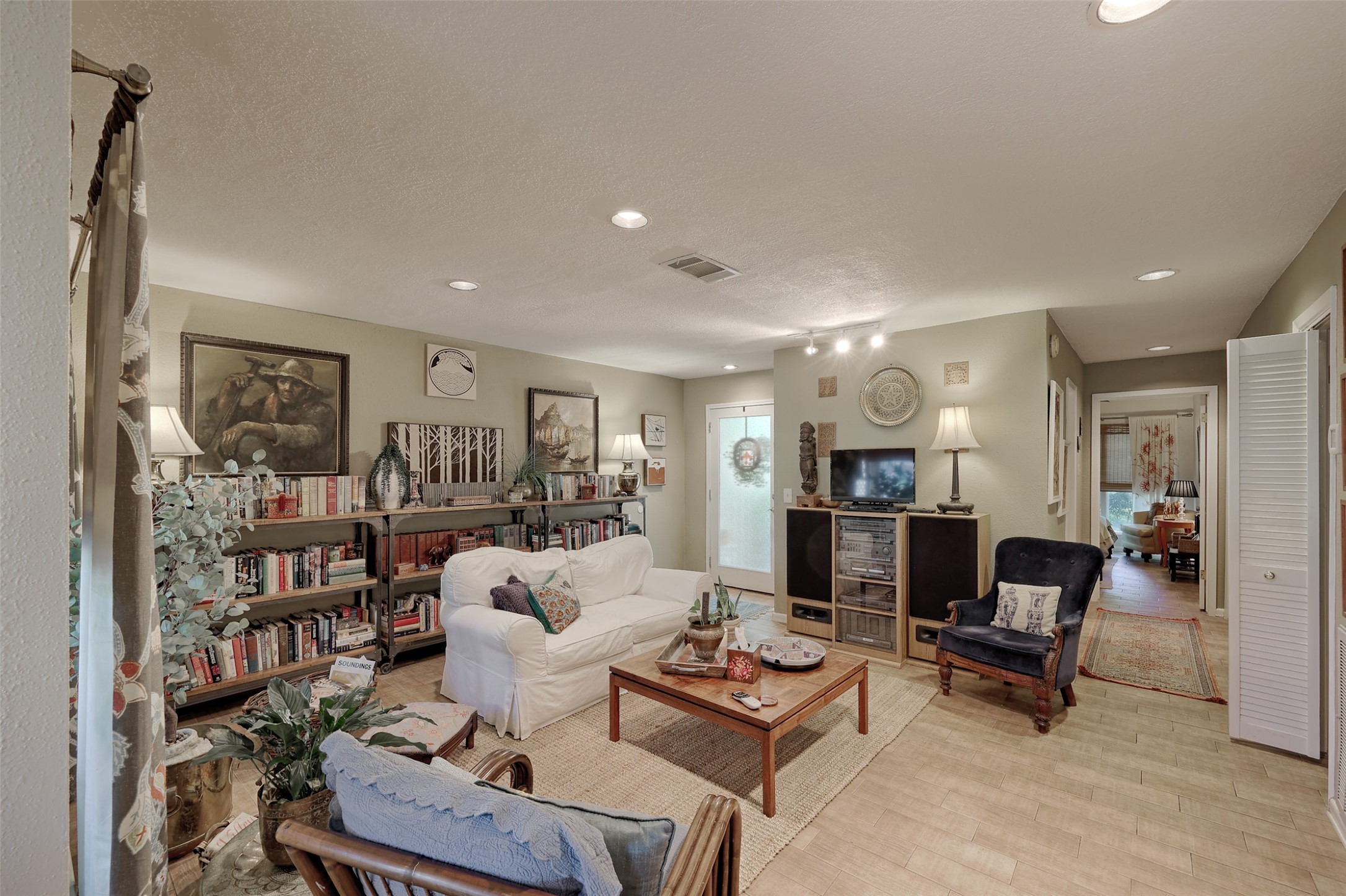 34 April Hill Conroe, TX 77356 - Photo 7 of 33 A look back at the living room and entry door beyond. To the right in this photo is the hallway leading to the bedrooms.