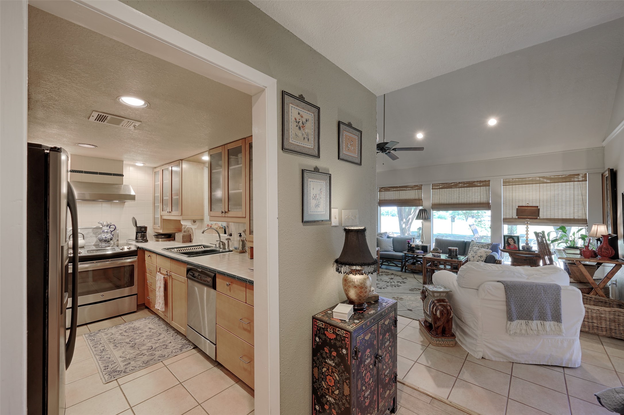 34 April Hill Conroe, TX 77356 - Photo 8 of 33 The galley style kitchen is off of the living room and adjacent to the family room.