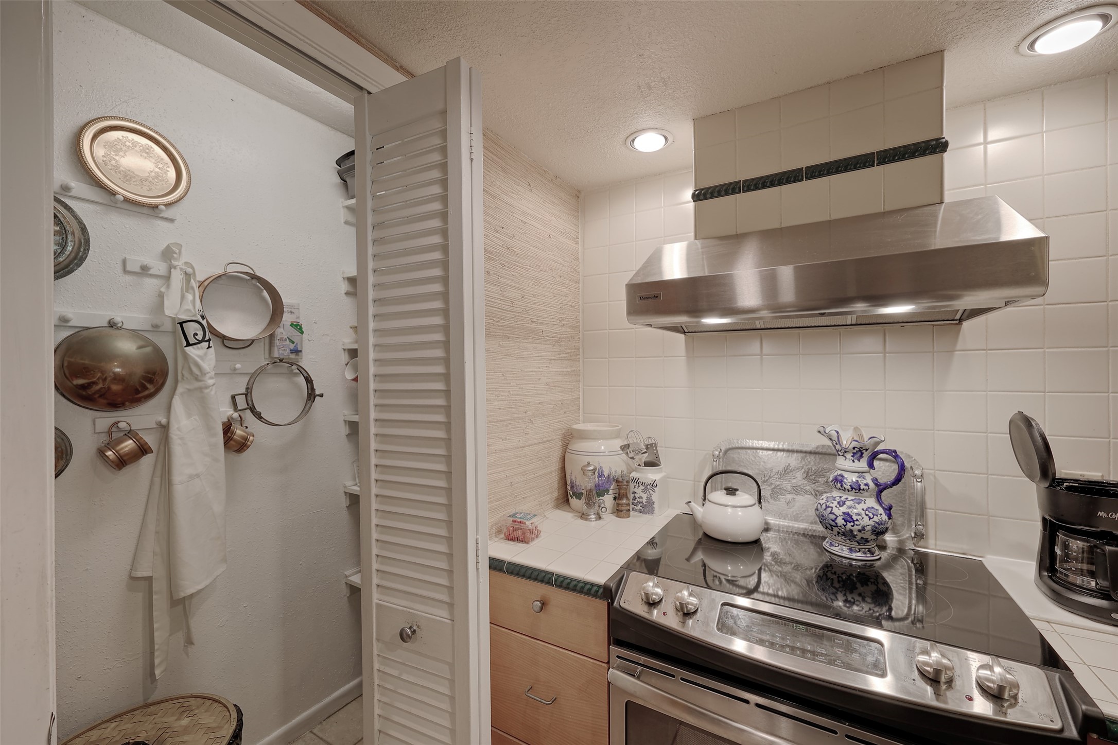 34 April Hill Conroe, TX 77356 - Photo 10 of 33 A walk-ion pantry off of the kitchen provides plenty of storage.