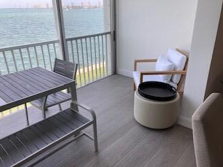 400 Wilma Circle, Unit 208 Riviera Beach, FL 33404 - Photo 11 of 28 a kitchen with a table and a chair