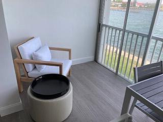 400 Wilma Circle, Unit 208 Riviera Beach, FL 33404 - Photo 12 of 28 a view of a hallway with washer and dryer