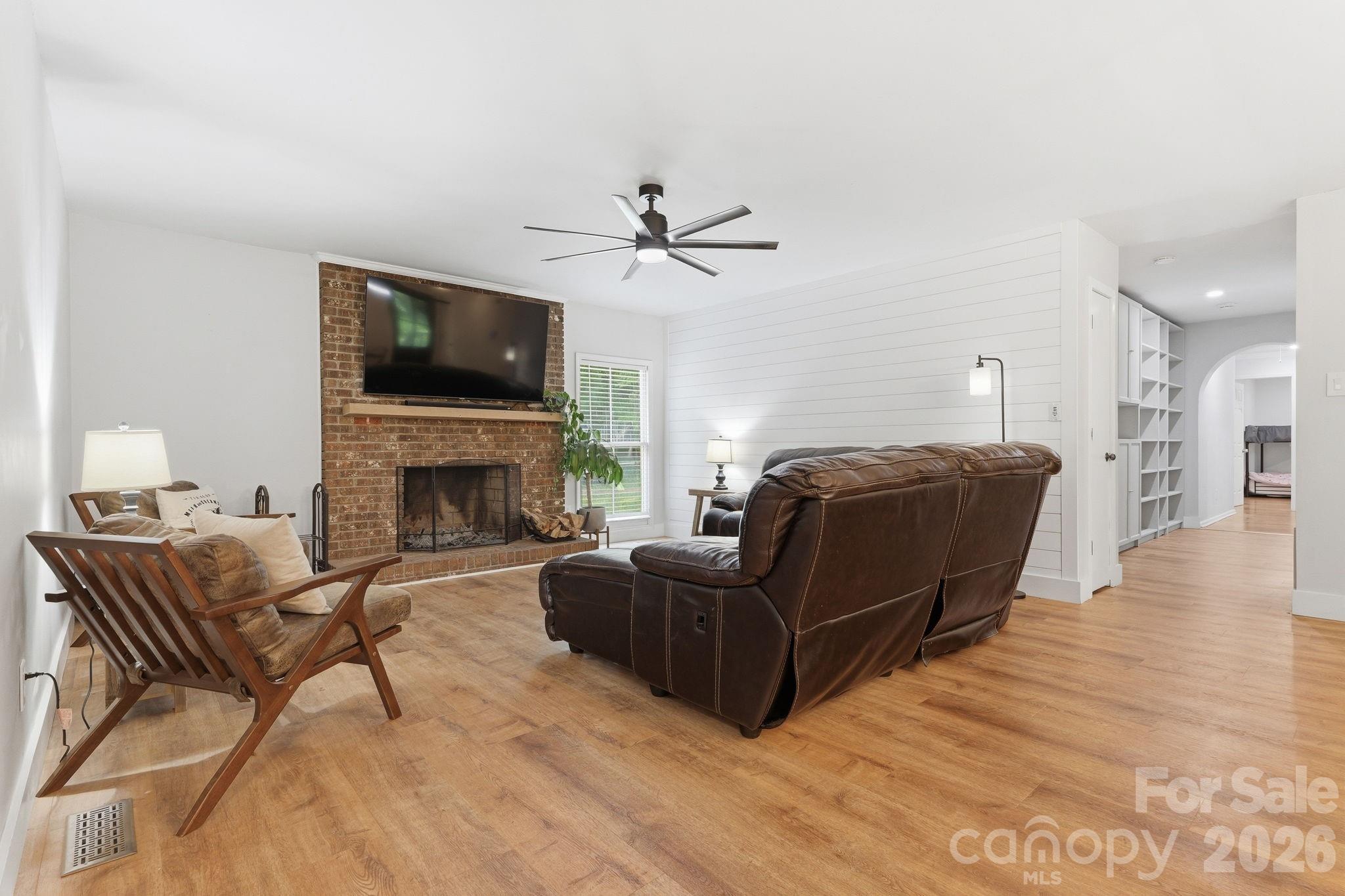 5347 Haney Road York, SC 29745 - Photo 7 of 39 a living room with furniture a flat screen tv and a fireplace