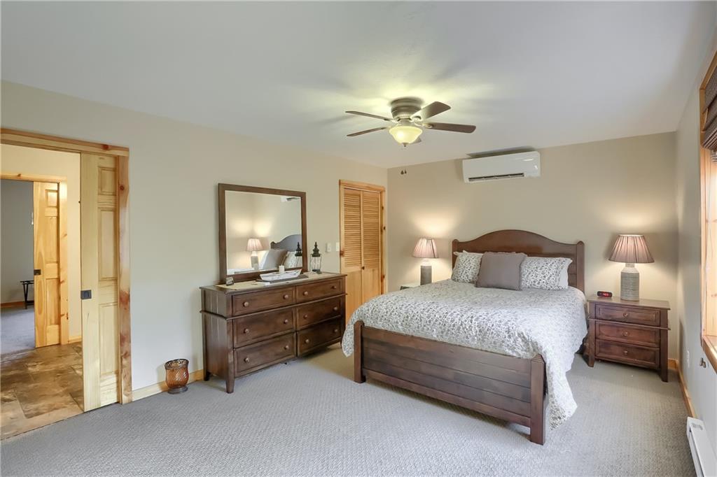 4038 State Route 156 Avonmore, PA 15618 - Photo 26 of 50 a bedroom with a bed and a chandelier