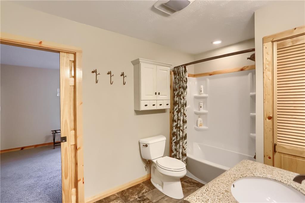 4038 State Route 156 Avonmore, PA 15618 - Photo 29 of 50 a bathroom with a granite countertop toilet a sink and a shower