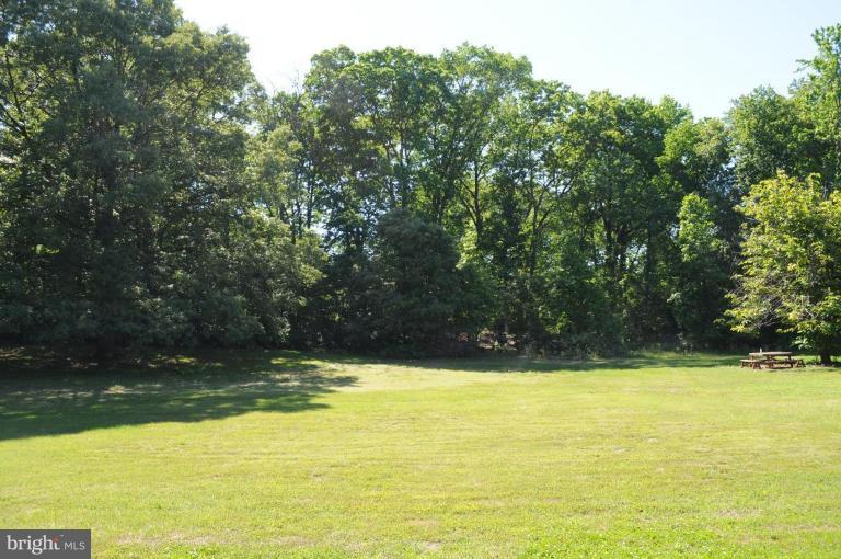 Telegraph Road Severn, MD 21144 - Photo 2 of 3 a view of a swimming pool with an outdoor space and seating area