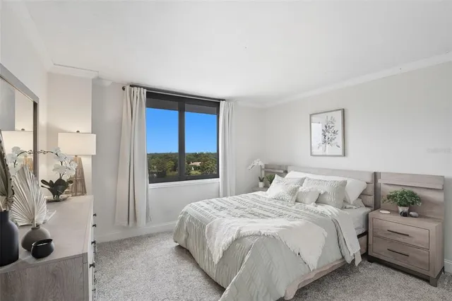 a bedroom with a bed and a view of bathroom