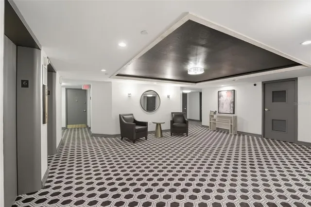 a living room with a furniture and a rug