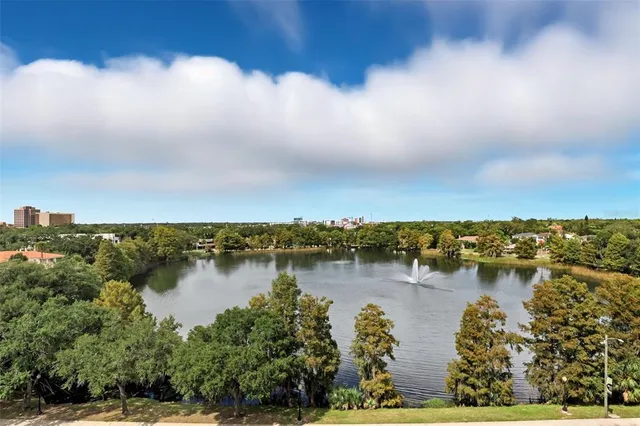 an aerial view of city and lake