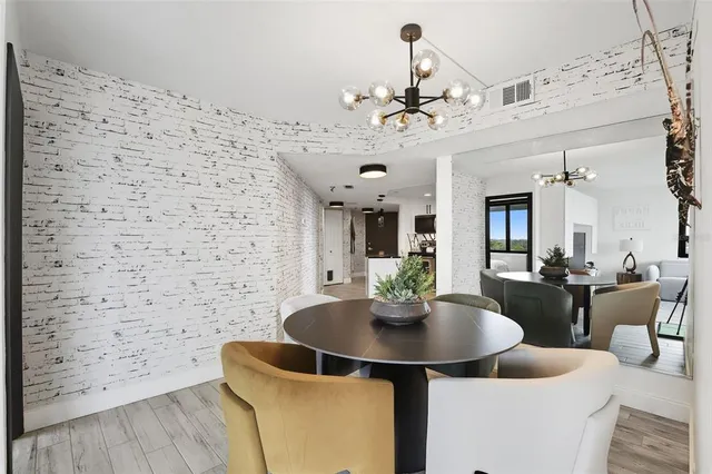a dining room with furniture and chandelier