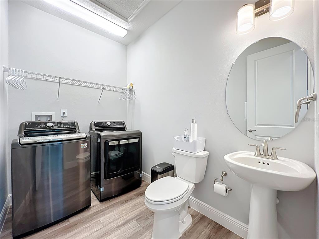 10220 Bay Lake Road Groveland, FL 34736 - Photo 56 of 67 a bathroom with a sink toilet and vanity