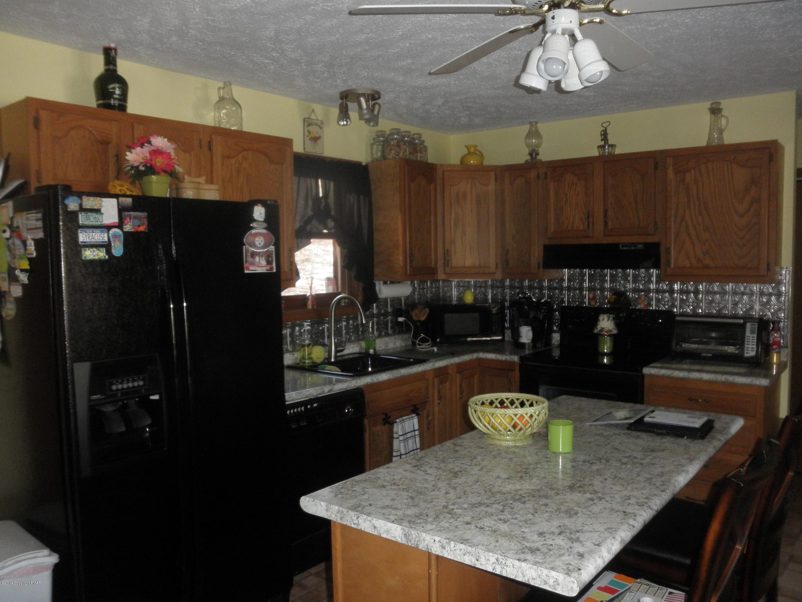 1025 Ridge Road Newfoundland, PA 18445 - Photo 12 of 45 Country Cabinetry w/Ornate Tin Backsplas