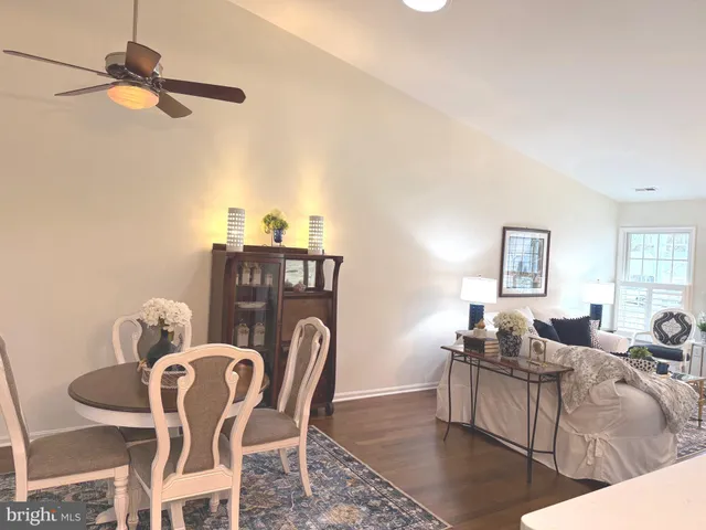 a bathroom with a toilet a sink and a mirror