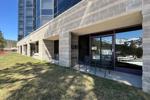 a swimming pool with outdoor seating and yard