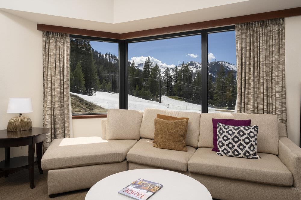 400 Resort Road, Unit 102104106 Olympic Valley, CA 96146 - Photo 2 of 27 a living room with furniture and a large window