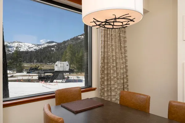 a view of living room with furniture and a chandelier
