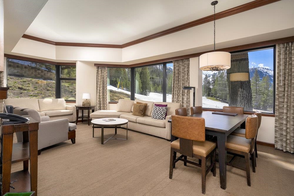 400 Resort Road, Unit 102104106 Olympic Valley, CA 96146 - Photo 4 of 27 a living room with furniture and a large window