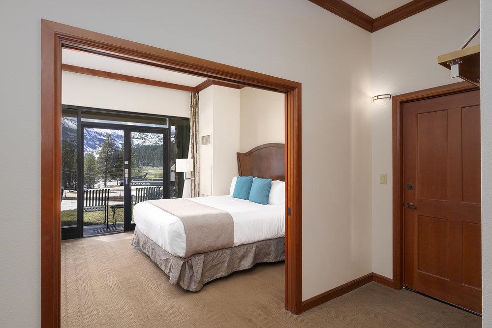 400 Resort Road, Unit 102104106 Olympic Valley, CA 96146 - Photo 10 of 27 a bedroom with a large bed and a large window