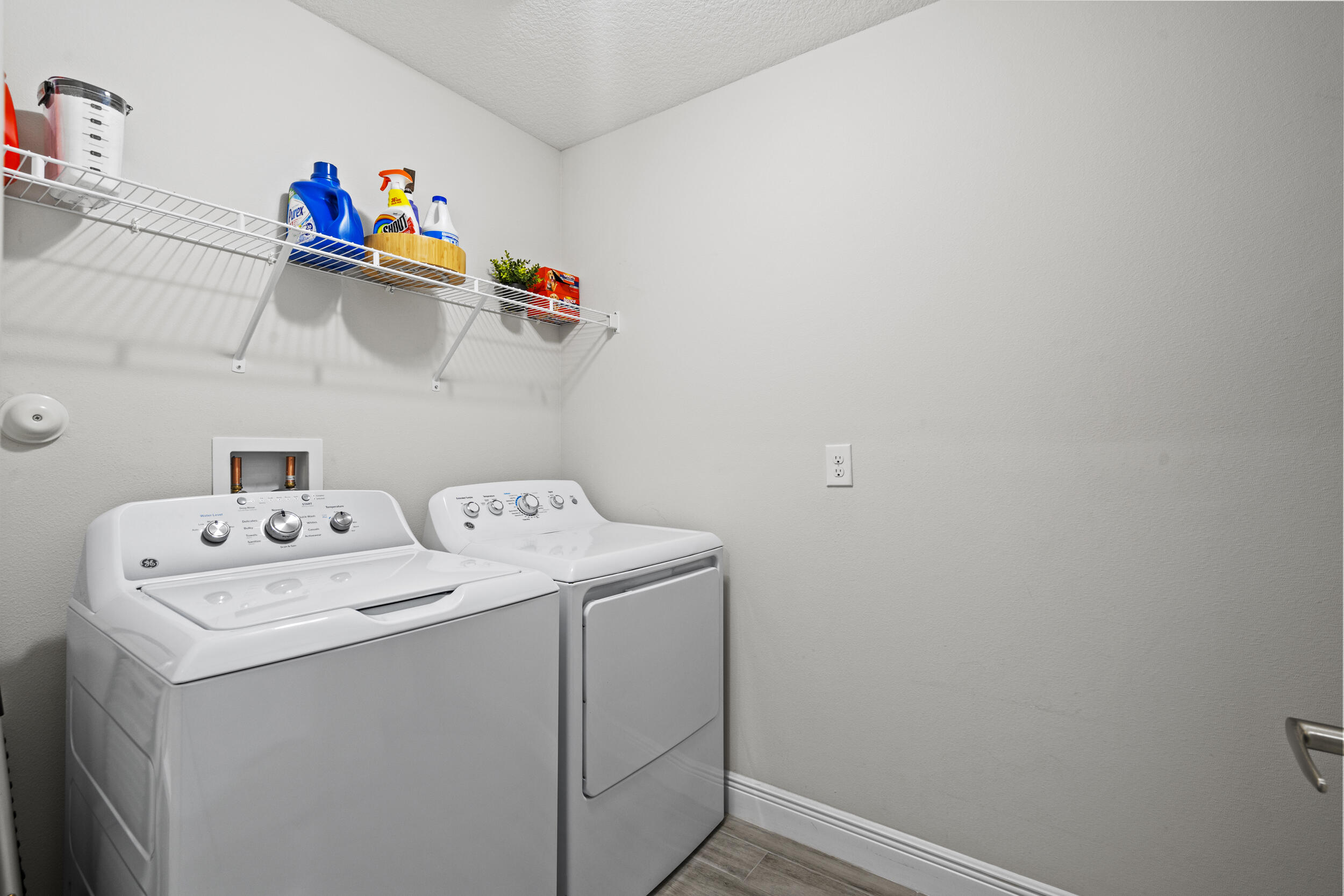 643 Southwest Curry Street Port St. Lucie, FL 34983 - Photo 15 of 21 a utility room with dryer and washer