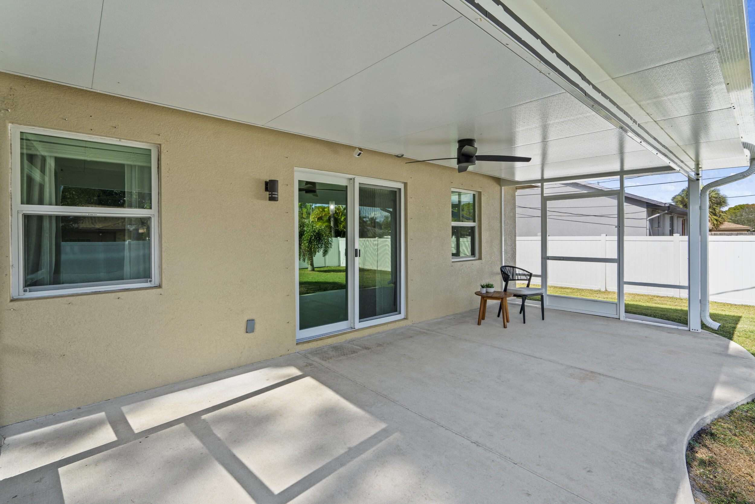 643 Southwest Curry Street Port St. Lucie, FL 34983 - Photo 17 of 21 a view of an empty room with furniture and a window
