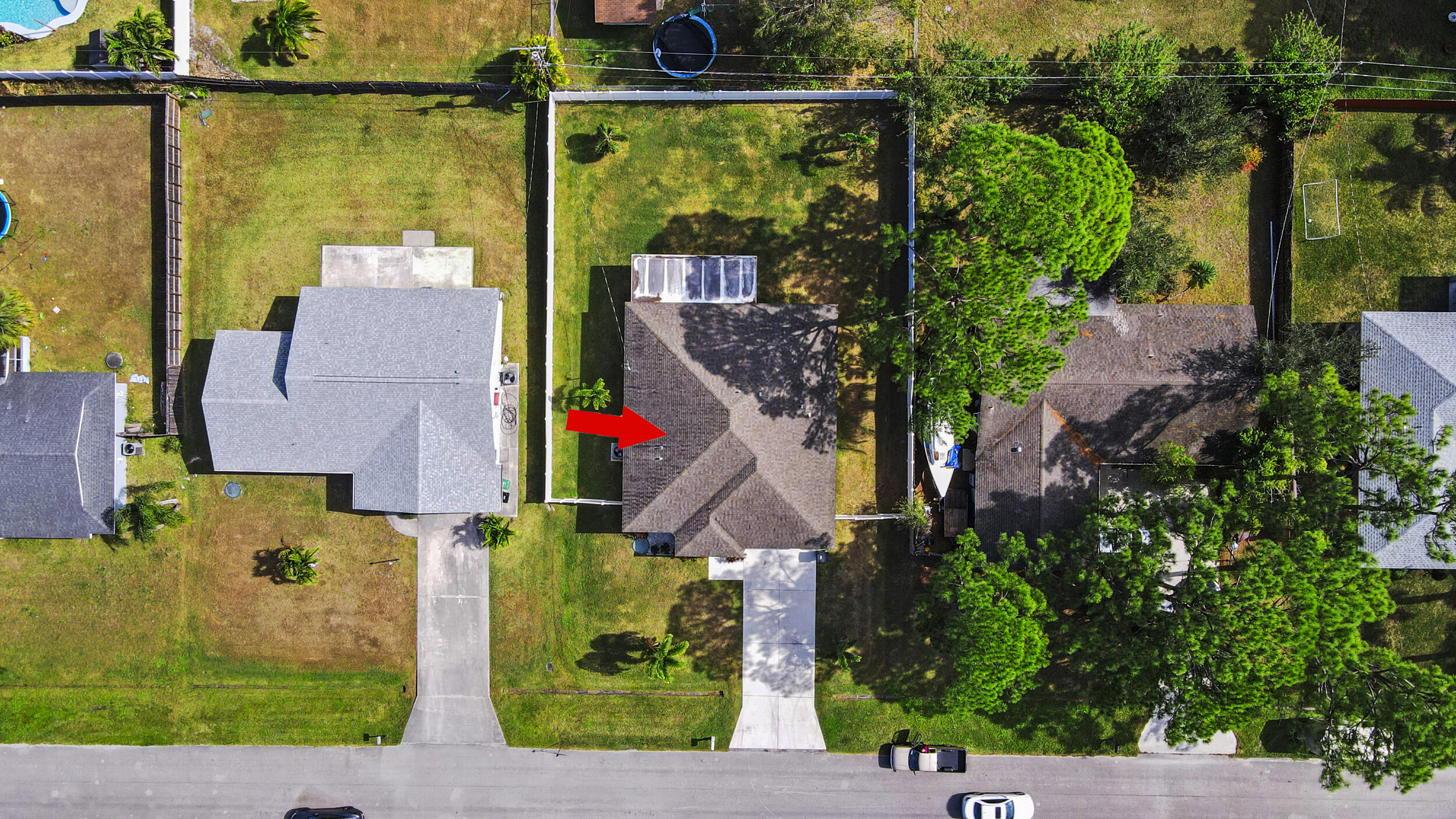 643 Southwest Curry Street Port St. Lucie, FL 34983 - Photo 18 of 21 front view of house with a yard