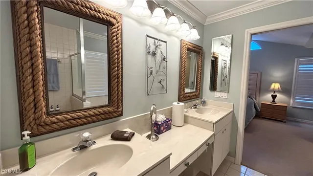 a bathroom with a double vanity sink and mirror