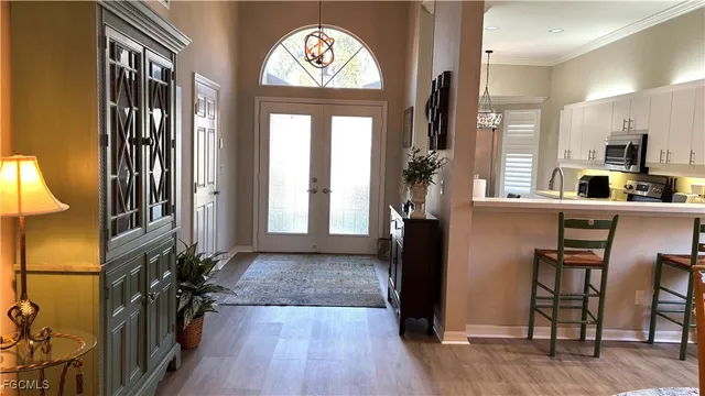 a view of a entryway with furniture and wooden floor