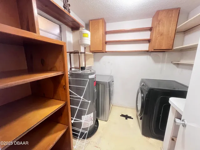 a storage room with washer and dryer