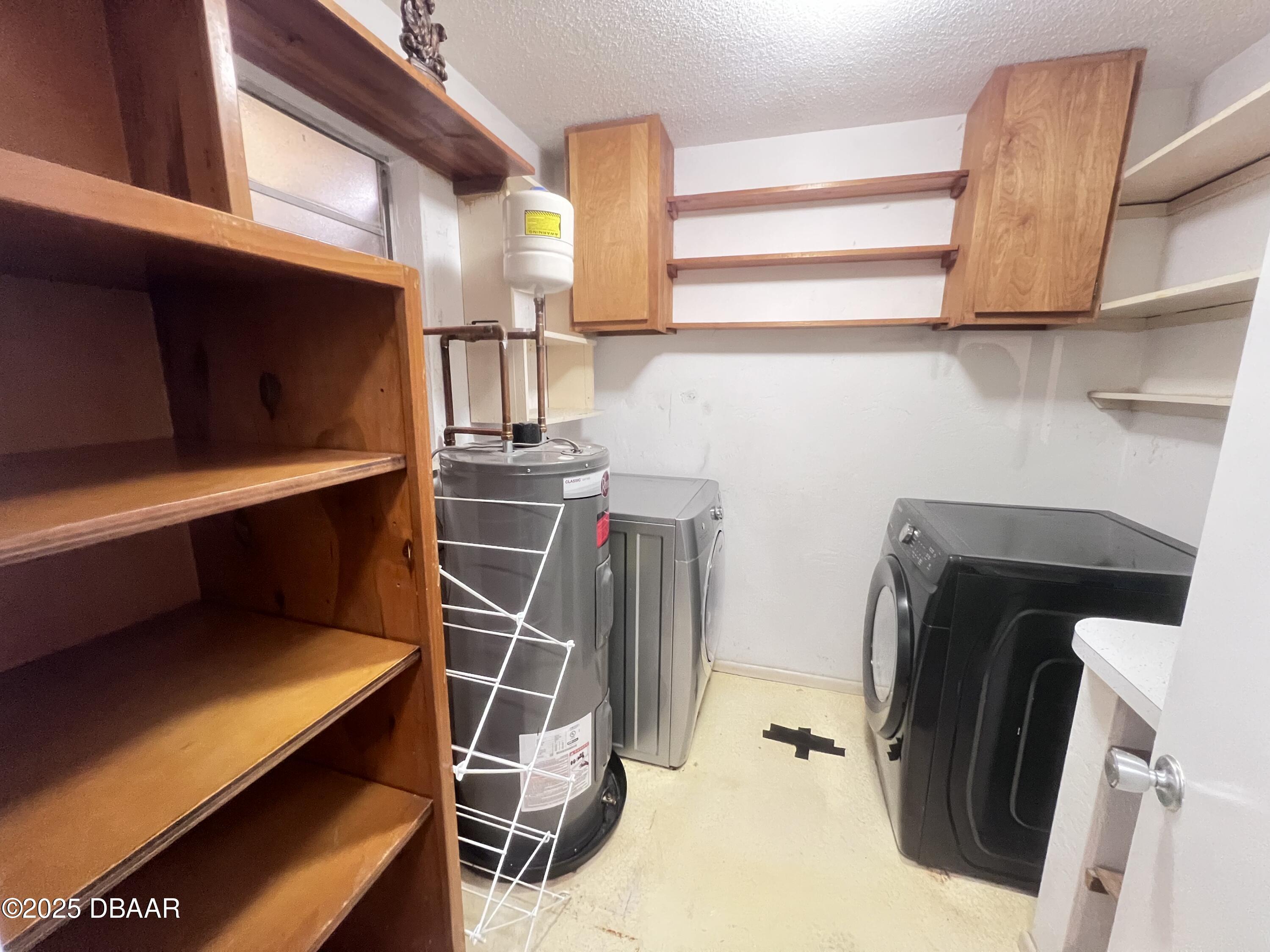 80 Cypress Pond Road Port Orange, FL 32128 - Photo 15 of 31 a storage room with washer and dryer
