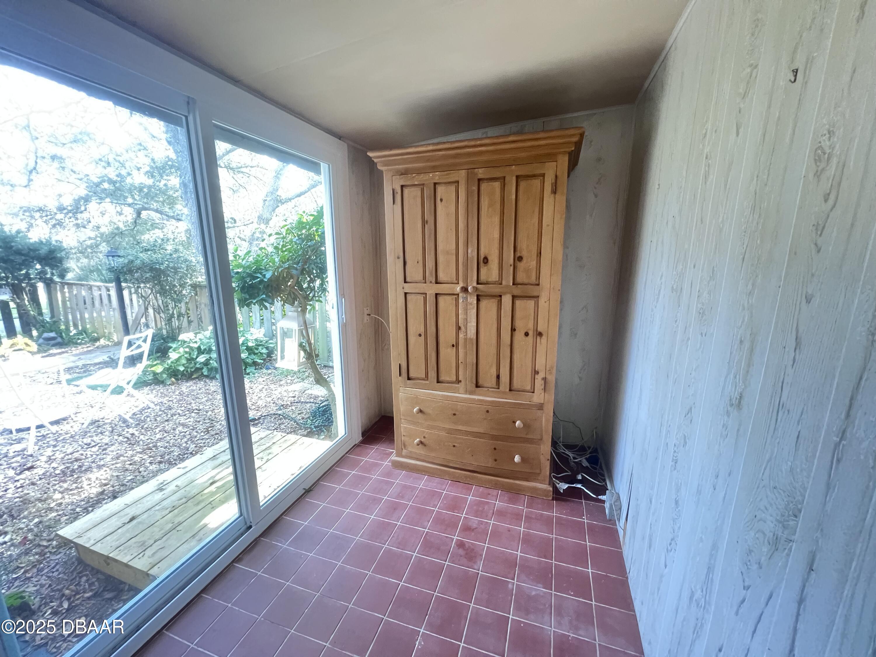 80 Cypress Pond Road Port Orange, FL 32128 - Photo 16 of 31 a view of empty room with wooden floor and windows