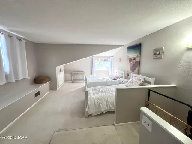 a bedroom with a bed and a sink