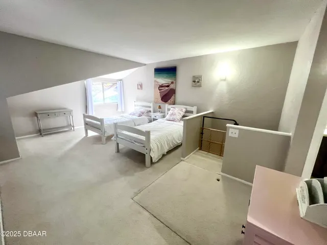 a bedroom with double bed and a window