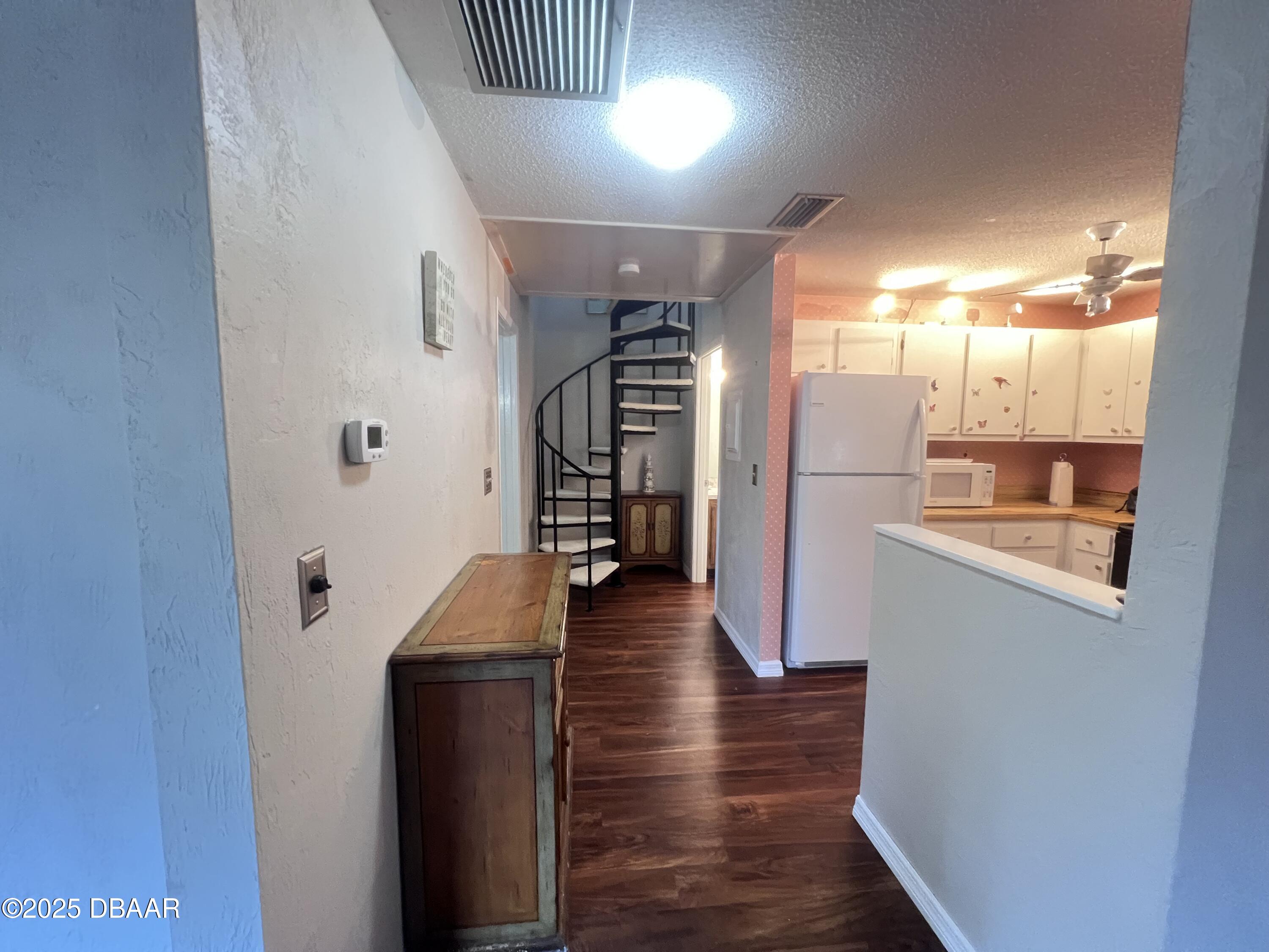 80 Cypress Pond Road Port Orange, FL 32128 - Photo 7 of 31 a view of a hallway view with wooden floor and staircase