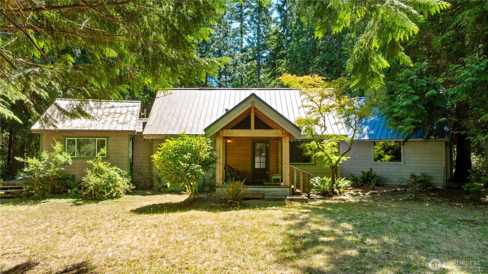 3330 Solitude Place Clinton, WA 98236 - Photo 1 of 1 front view of house with a yard