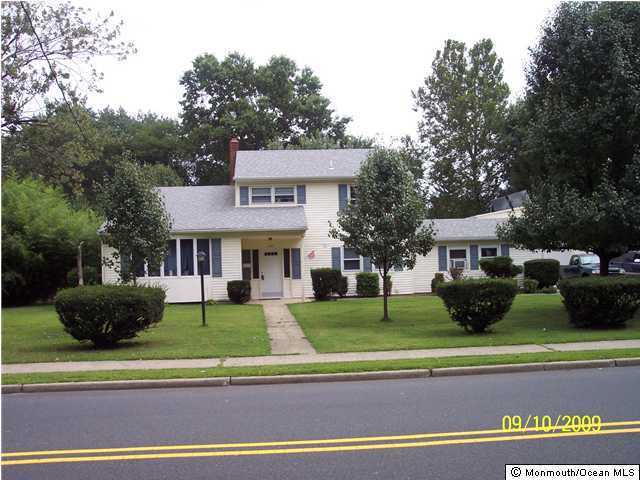 257 Harmony Road Middletown, NJ 07748 - Photo 3 of 3 a front view of a house with a yard