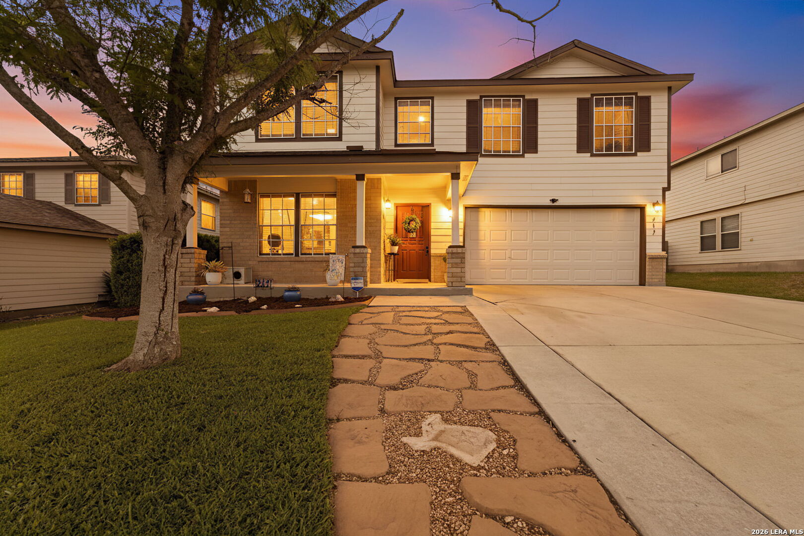 a front view of a house with a yard
