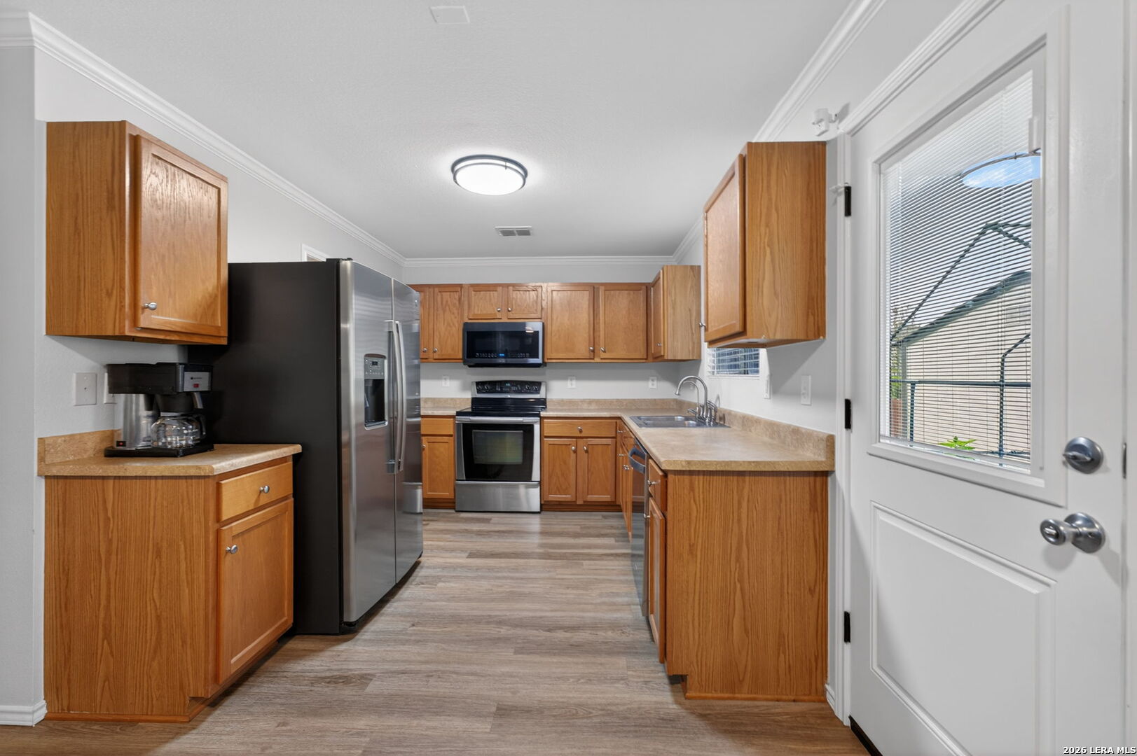 217 Willow Run Cibolo, TX 78108 - Photo 17 of 41 a kitchen with granite countertop stainless steel appliances cabinets a sink and a counter space