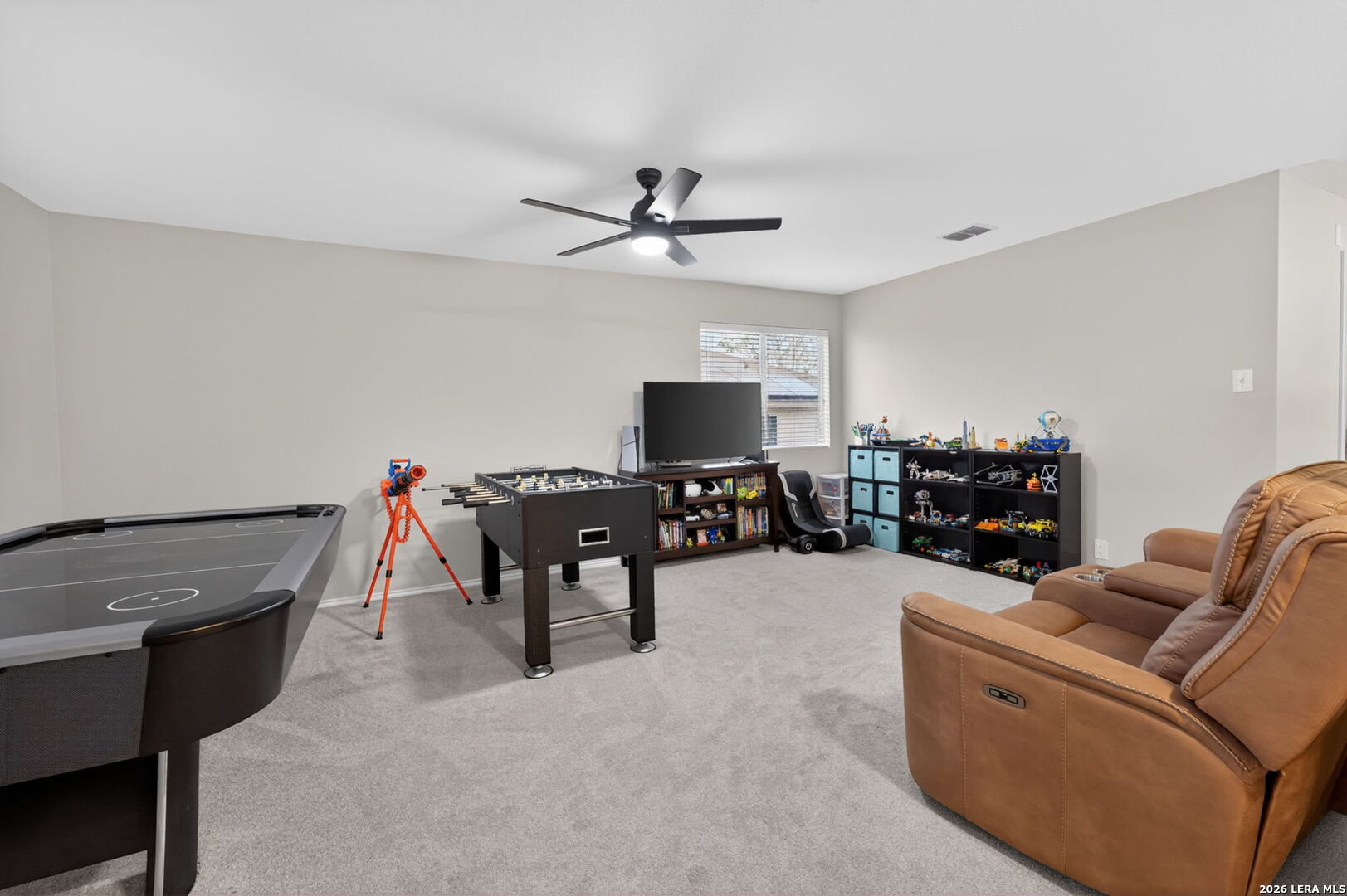 217 Willow Run Cibolo, TX 78108 - Photo 21 of 41 a living room with furniture and a flat screen tv