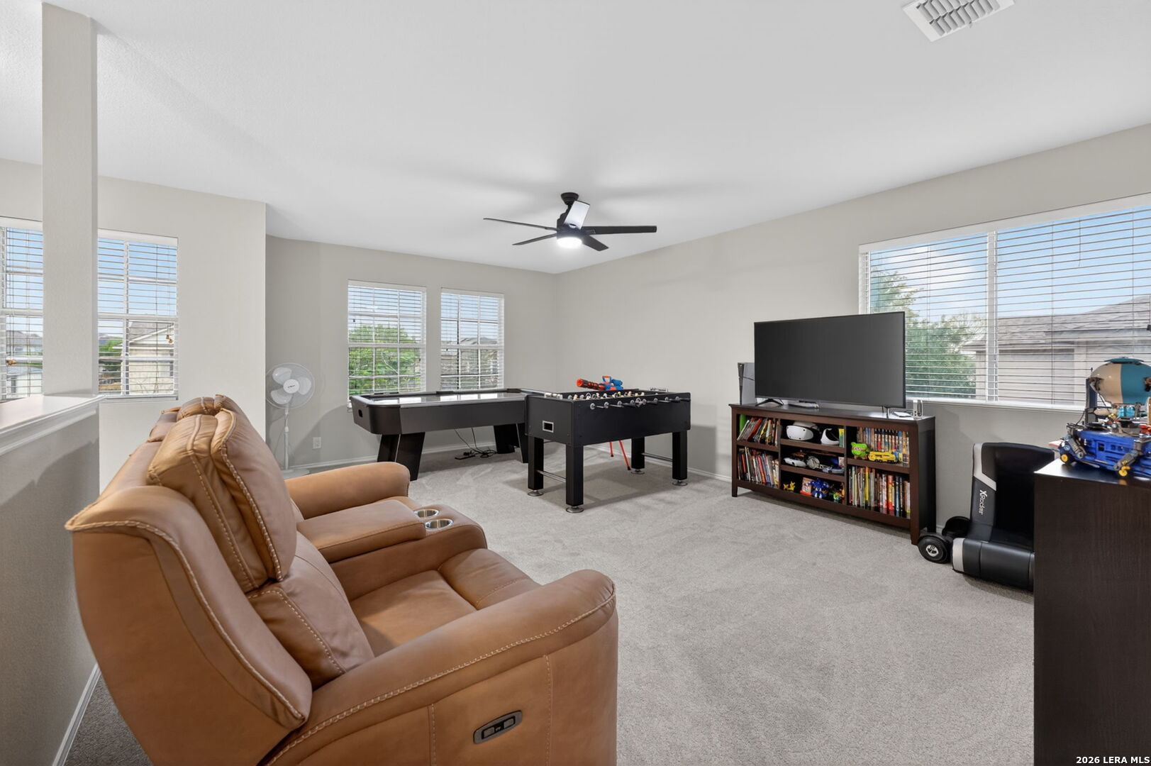 217 Willow Run Cibolo, TX 78108 - Photo 23 of 41 a living room with furniture and a flat screen tv