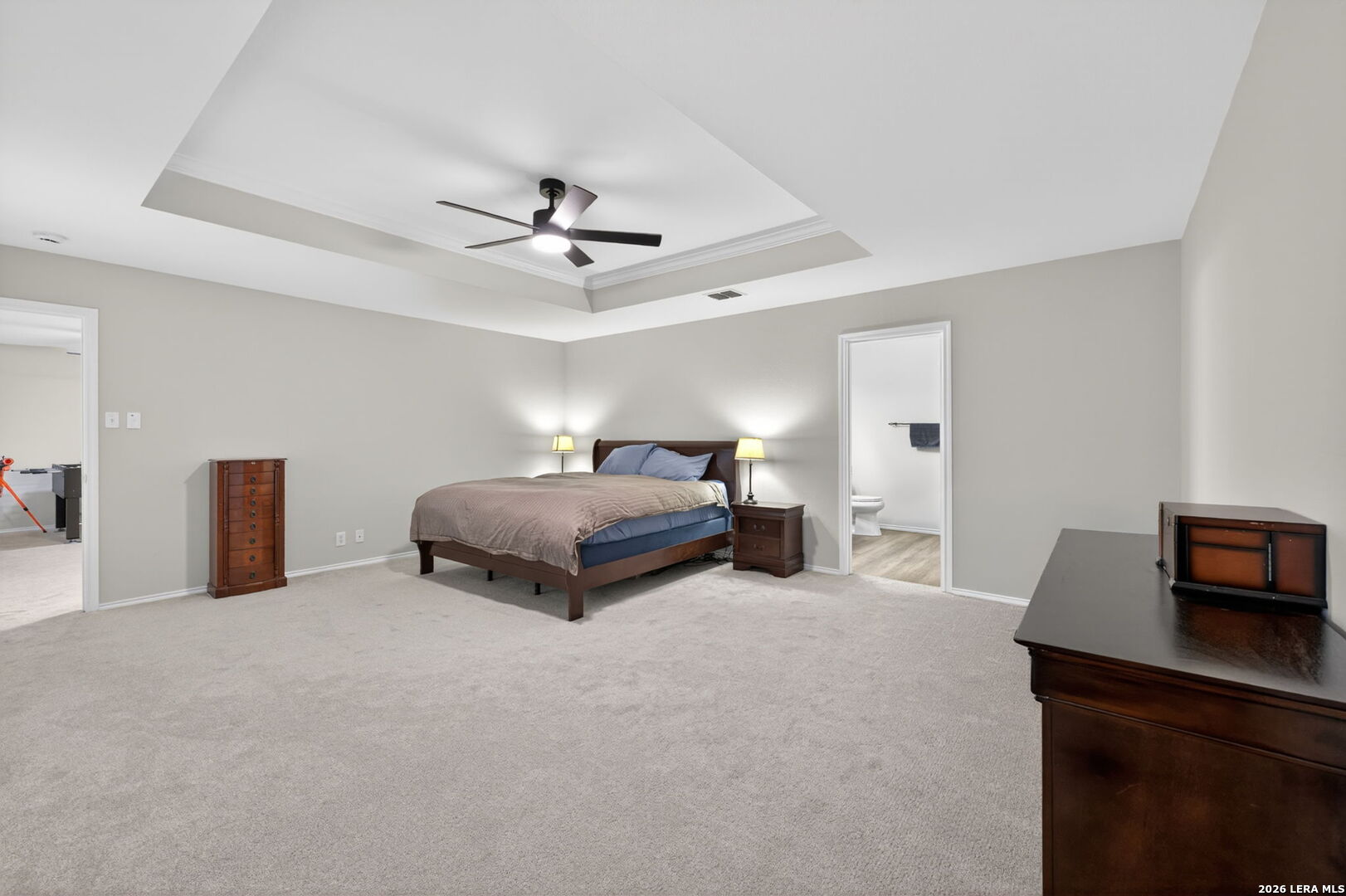 217 Willow Run Cibolo, TX 78108 - Photo 25 of 41 a spacious bedroom with a bed and a desk