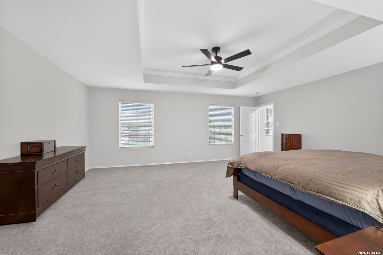 217 Willow Run Cibolo, TX 78108 - Photo 26 of 41 a spacious bedroom with a bed and a window