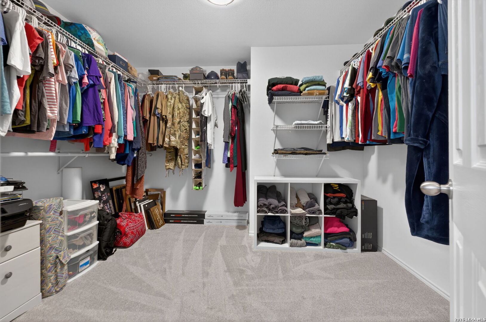 217 Willow Run Cibolo, TX 78108 - Photo 30 of 41 a view of walk in closet with clothes and shoes