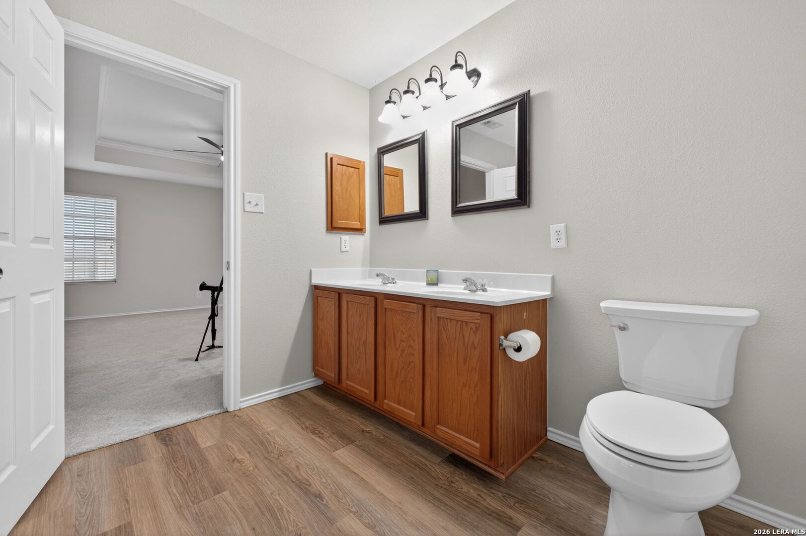 217 Willow Run Cibolo, TX 78108 - Photo 33 of 41 a bathroom with a toilet sink and mirror