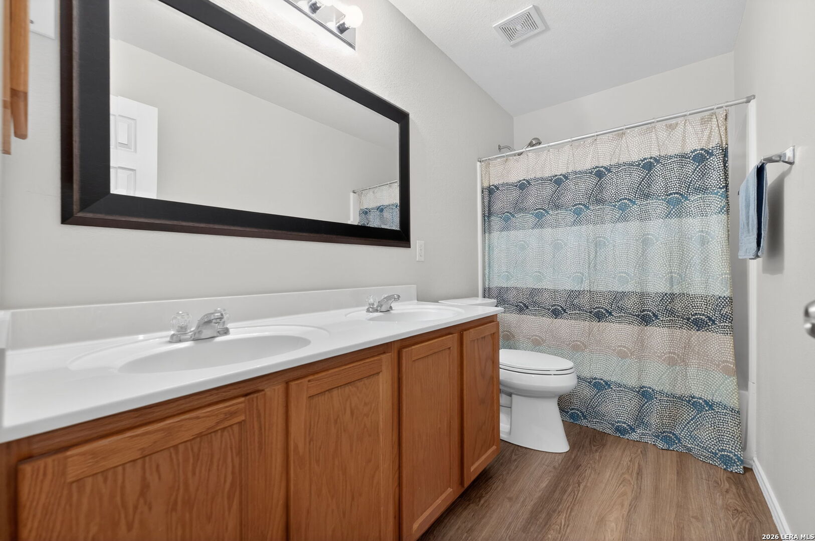 217 Willow Run Cibolo, TX 78108 - Photo 34 of 41 a bathroom with a sink a toilet and shower