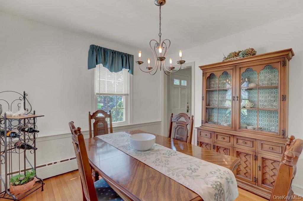 5 Newell Road Merrick, NY 11566 - Photo 6 of 19 a view of a dining room with furniture window and wooden floor