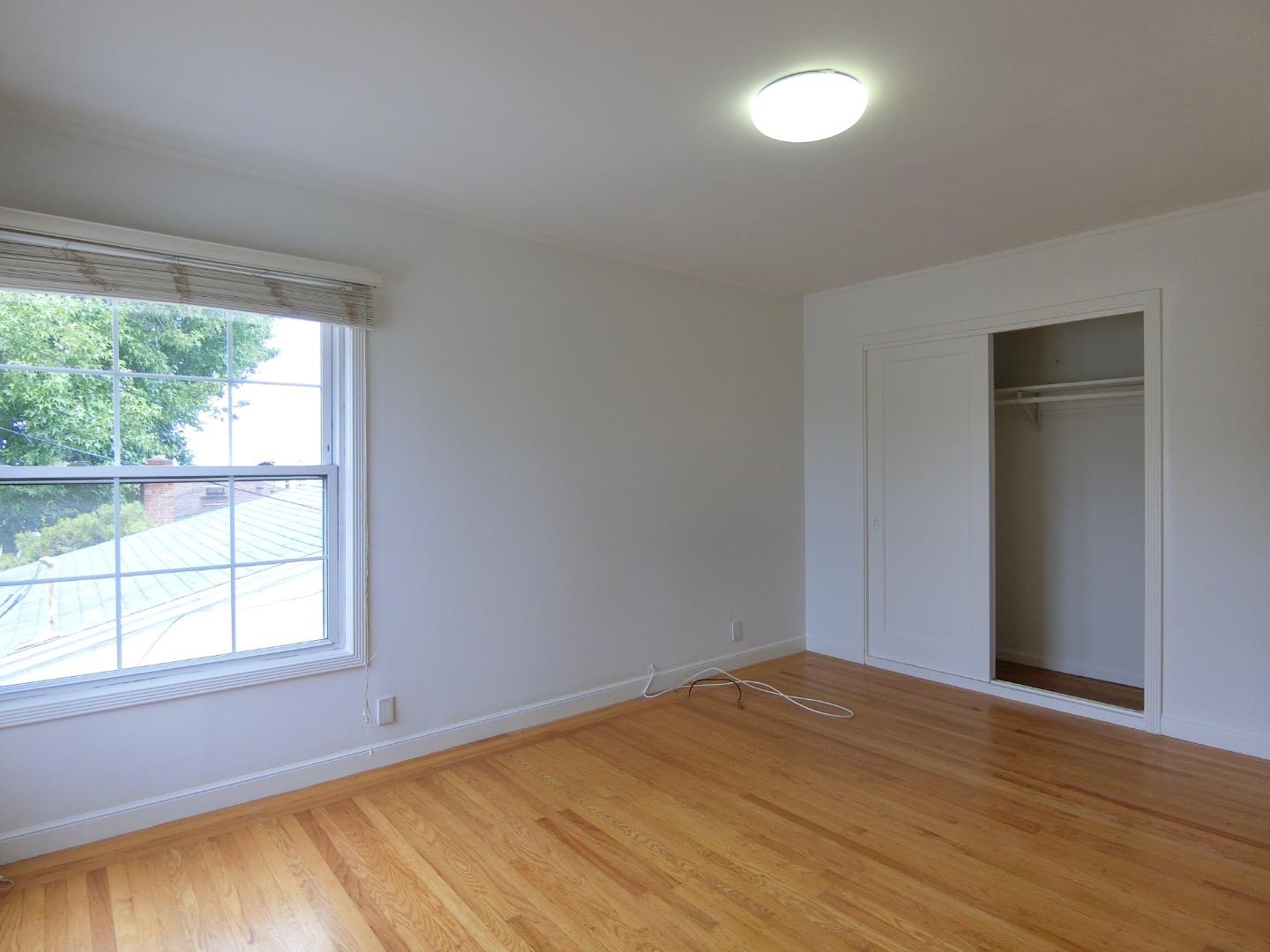 339 Paramount Drive Millbrae, CA 94030 - Photo 4 of 14 a view of empty room with wooden floor and fan